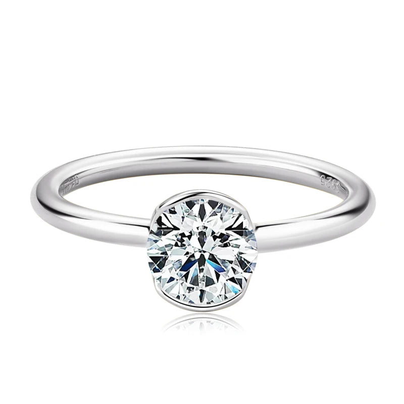 Silver ring with a diamond on a white background