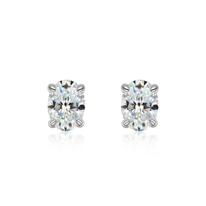 Pair of diamond stud earrings on a white background