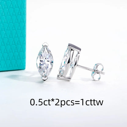 Pair of silver stud earrings with clear gemstones on a white background