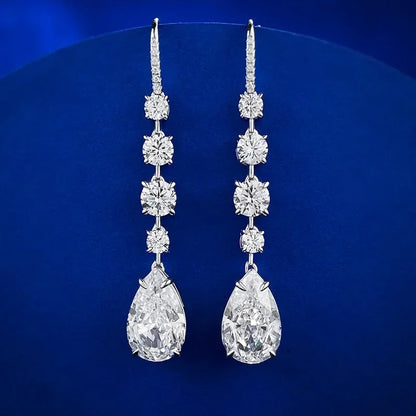 Pair of diamond earrings on a blue background