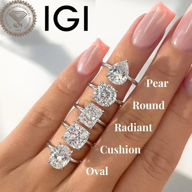 Diamond rings with different shapes on a hand, featuring the IGI logo.