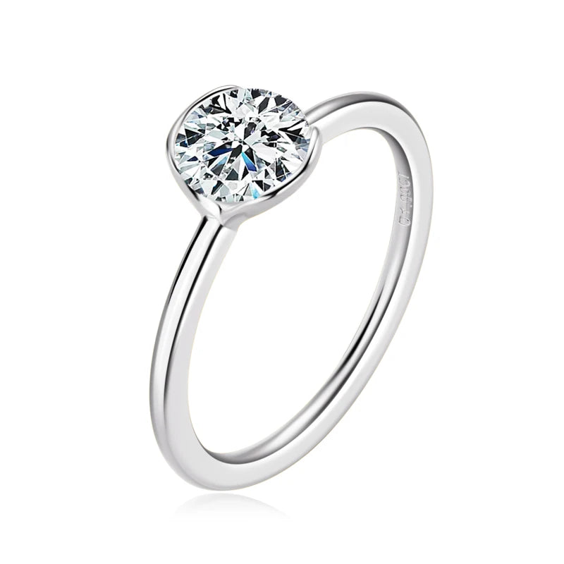 Silver ring with a heart-shaped diamond on a white background