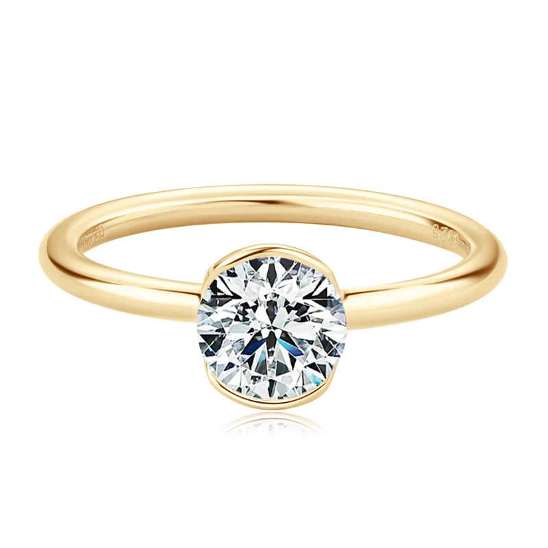 Gold ring with a diamond on a white background