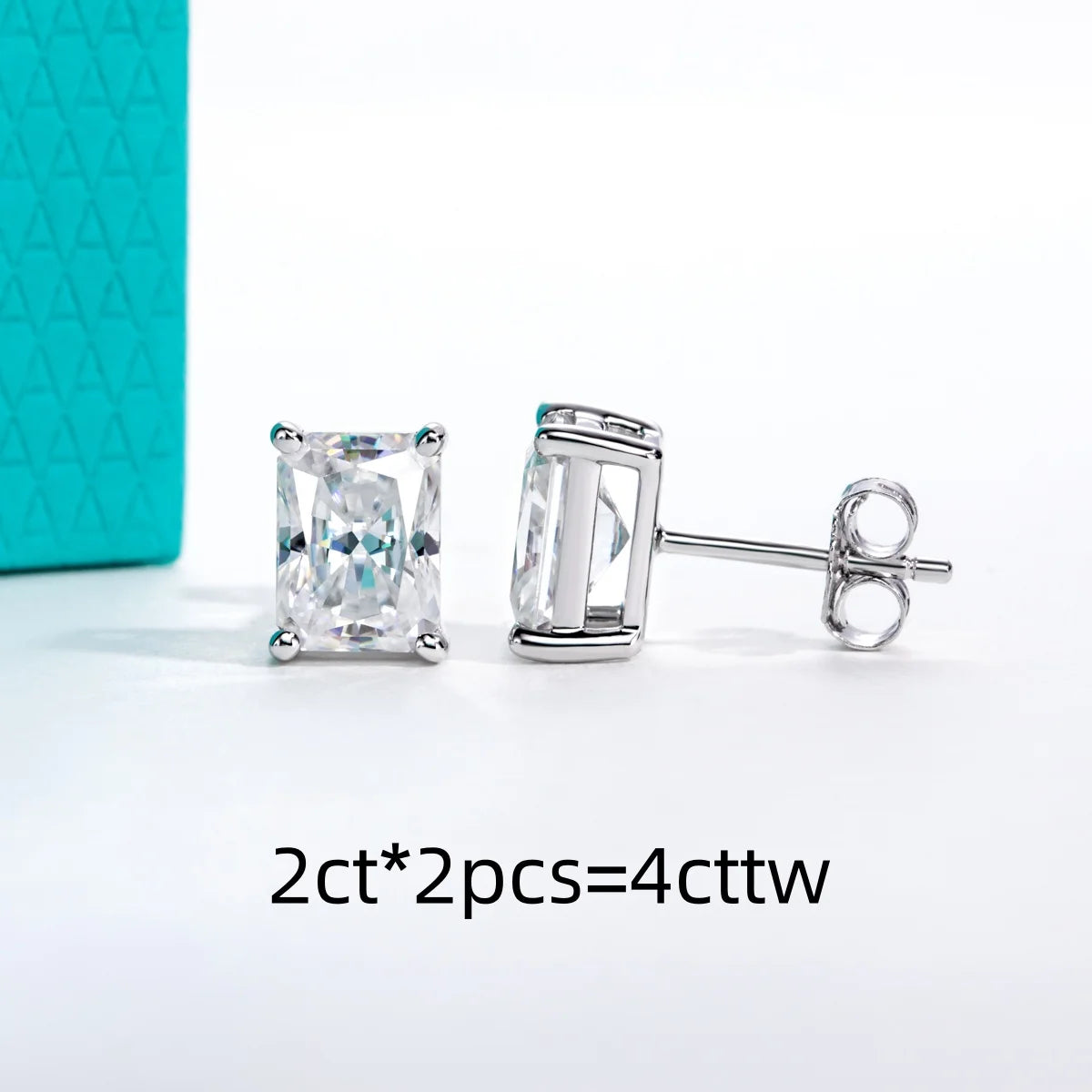 Pair of diamond stud earrings with a turquoise box in the background