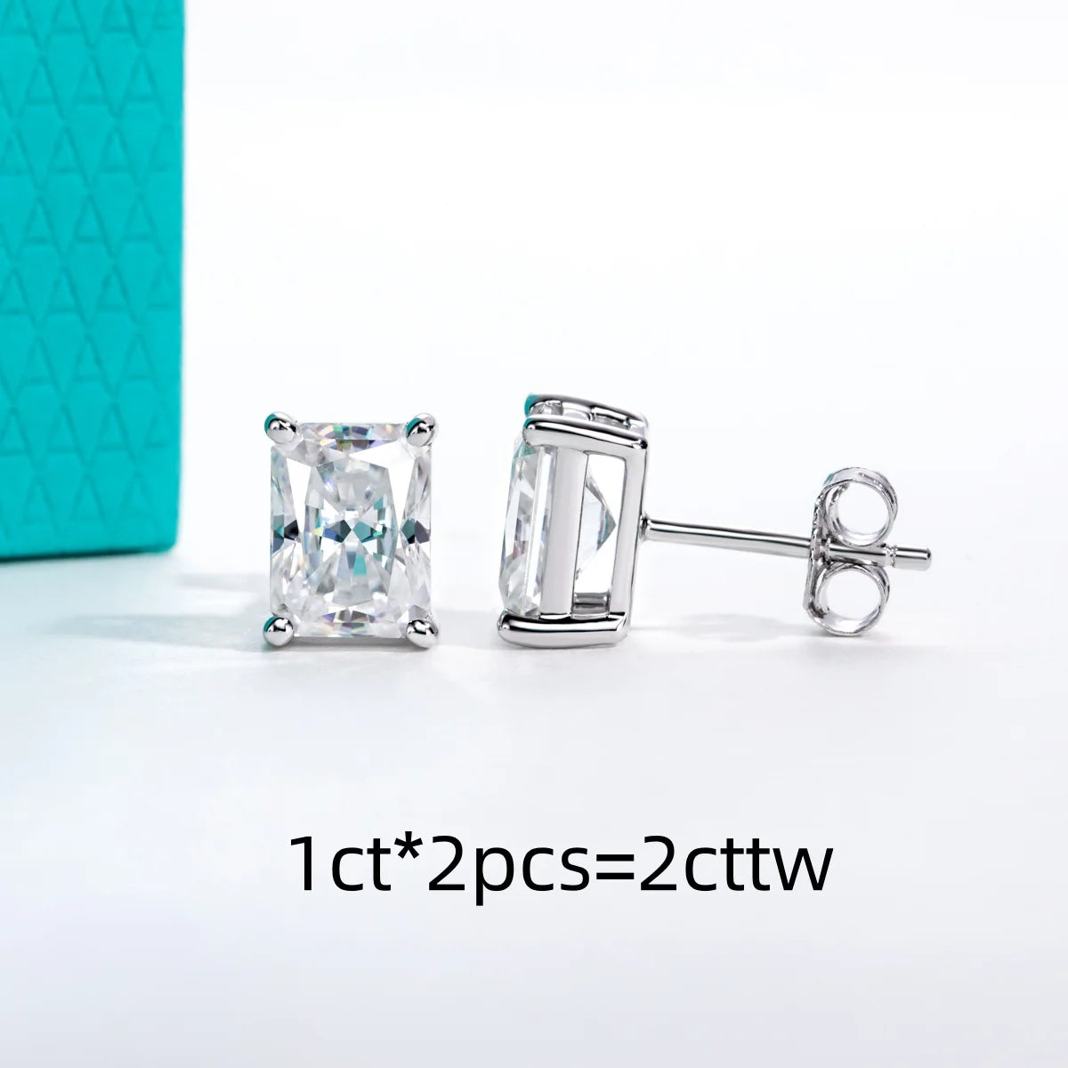 Pair of silver stud earrings with clear gemstones on a white background