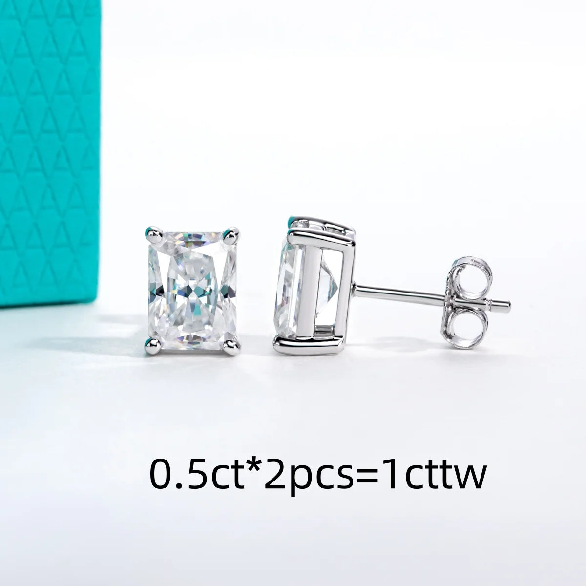 Silver stud earrings with gemstones on a white background
