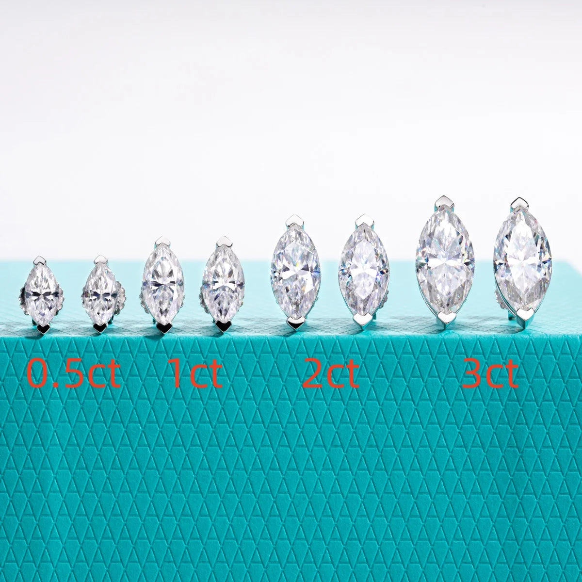 Set of diamond stones with weight labels on a teal background