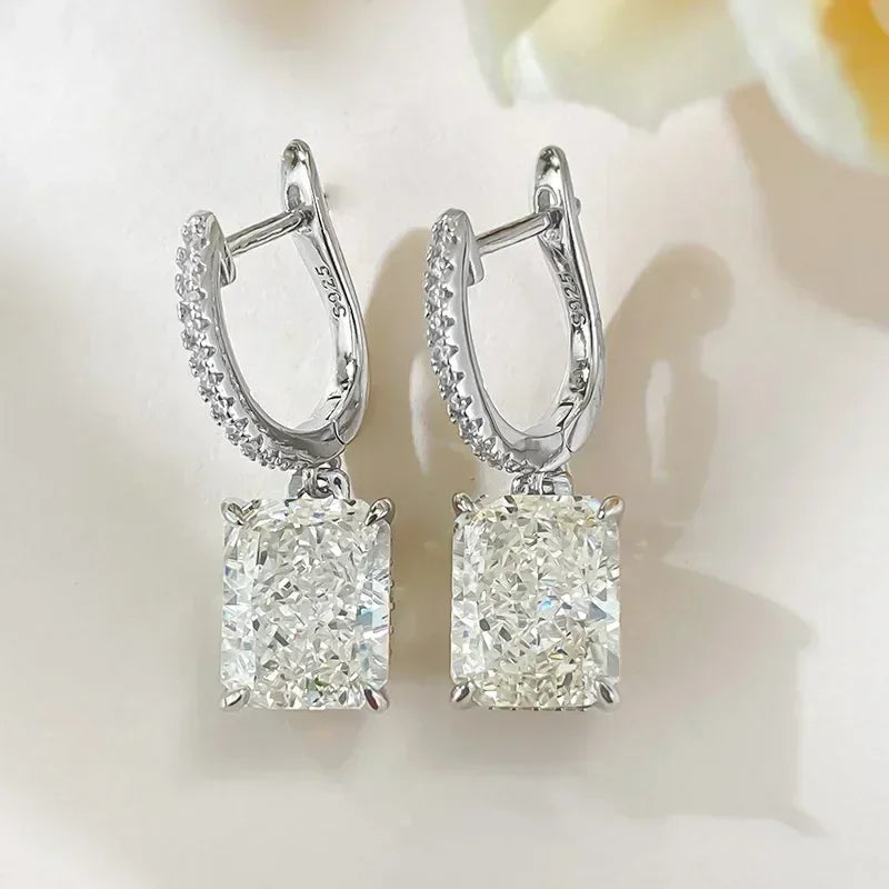 Pair of diamond earrings on a soft white background