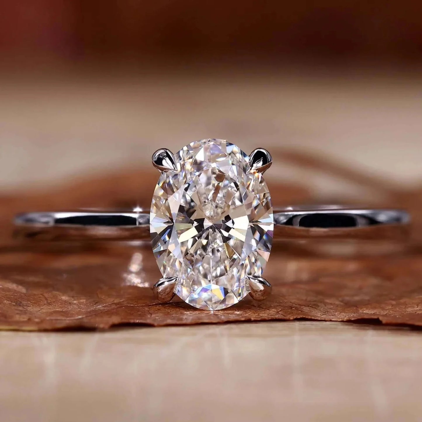 Diamond ring on a wooden surface with a blurred background