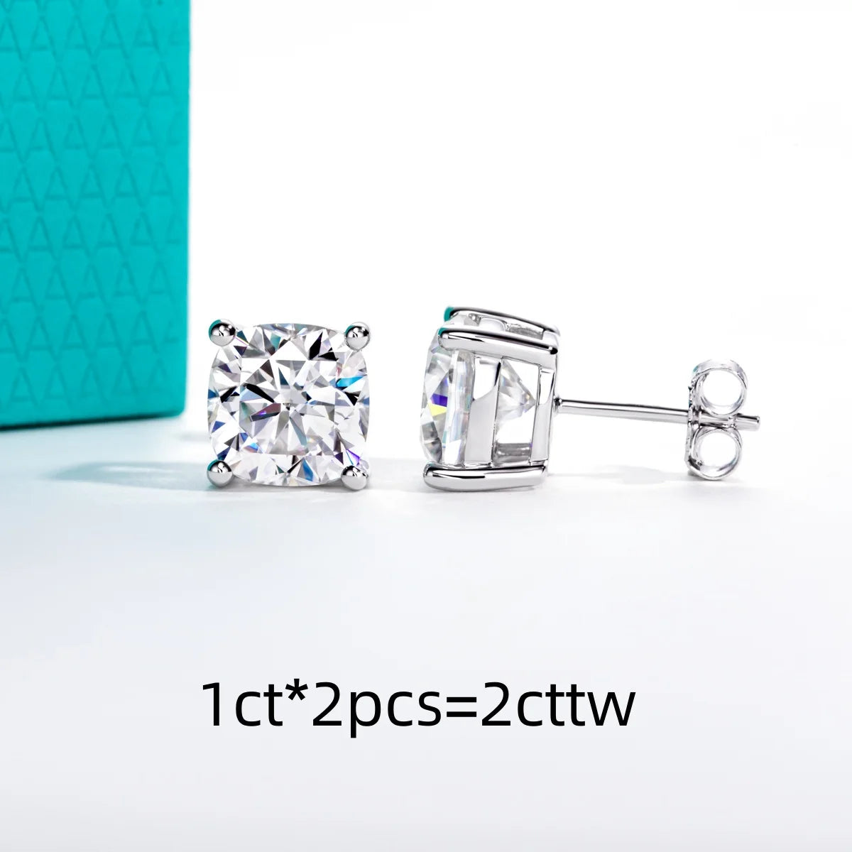 Pair of diamond stud earrings with a turquoise box in the background