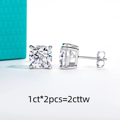 Pair of diamond stud earrings with a turquoise box in the background